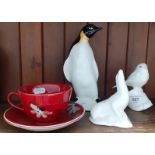 Various items of Poole Pottery including Daisy Chain cup and saucer, a penguin, a robin and a seal.