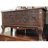 A George III mahogany chest of drawers, standing on bracked feet.