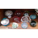 10 glass paperweights including millefiore and examples by Caithness, Selkirk, Wedgwood Glass etc.