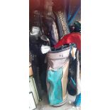 2 bags of golf clubs comprising Callaway, Cobra and a Ping putter.