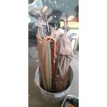 2 bags of golf vintage clubs and 3 walking sticks