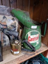 A vintage Castrol oil funnel and a vintage blow lamp.