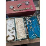 Mixed lot comprising two boxes of costume jewellery, jewellery boxes, brooches, etc.