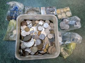 A tub of UK and world coins.