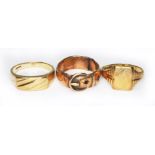 A group of three hallmarked 9ct gold rings, gross wt. 15.6g.
