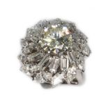 A diamond cluster ring in the manner of Boucheron, circa 1960s, the principal round brilliant cut