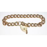 A hallmarked 9ct gold link bracelet with heart shaped padlock clasp, length 16cm, wt. 26.2g.