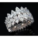 A diamond eternity ring, formed from a double row of diamonds comprising eighteen pear cut