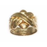 A hallmarked 9ct gold ring of knotted form, Sheffield 1999, wt. 13g, size W/X. Condition - general