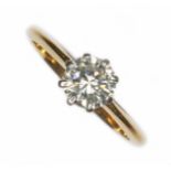 A mid 20th century diamond solitaire ring, the eight claw set round cut stone weighing approx. 0.