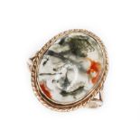 A moss agate cabochon ring, rope twist and bezel mounted agate measuring approx. 16mm x 13mm,