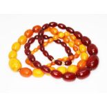 Two graduated bead necklaces; one marbled cherry bakelite and one butterscotch amber, beads