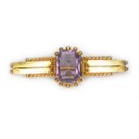 A late Victorian Etruscan style amethyst bar brooch, hallmarked 9ct gold, sponsor 'R.Bs' for Rolason