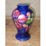A Moorcroft pottery vase, height 15cm. Condition - good, no damage/repair.
