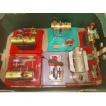 A box of assorted stationary live steam models comprising four Mamod engines and two accessories and