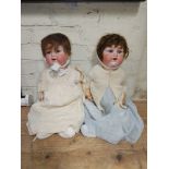 Two Armand Marseille 990 bisque headed dolls.