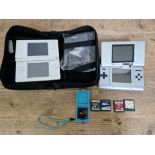 Two Nintendo DS portable games consoles with a few games and case.