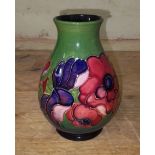A Moorcroft pottery vase, height 14cm. Condition - good, no damage/repair.