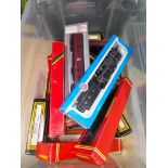 A box of assorted 00 gauge model railway including Airfix, Hornby and Dapol.