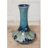 A Moorcroft leaf and fruit vase, height 30cm. Condition - good, no chips, cracks nor any signs of