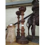 A pair of carved oak church candlesticks, height 49.5cm.