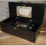 A late 19th century 8 airs rosewood cylinder music box, length 43cm. Condition:- General wear