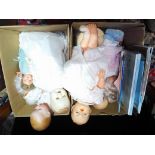 Two boxes of antique and vintage dolls including Armand Marseille.