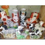 A box of assorted Staffordshire pottery animals.