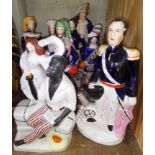 A collection of six Staffordshire figures including Uncle Tom, tallest 32cm.