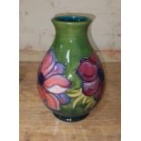A Moorcroft pottery vase, height 19cm. Condition - good, no chips, cracks nor any sign of
