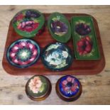 Seven pieces of Moorcroft pottery.