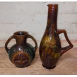 Two Linthorpe pottery jugs in the manner of Christopher Dresser, height19.5cm & 34cm. Condition -