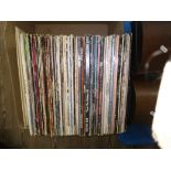 A box of vinyl LP records, various artists and genres, including The Beatles, Pink Floyd etc.