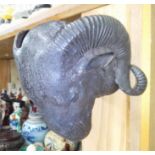 A cast bronze ram's head, depth 14cm.