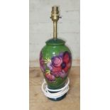A Moorcroft pottery lamp base, height (including fitting) 39cm. Condition - no chips, cracks nor any