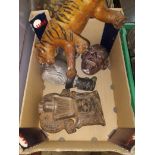 A mixed lot including a South American terracotta figure, a leather tiger etc.