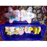 A box of toys including Poly Pocket and Sylvanian Families.