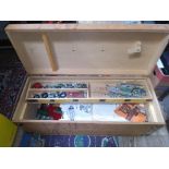 A wooden box of assorted Meccano.