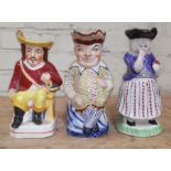 A group of three 19th century toby jugs including Lady Snuff Taker and Punch.