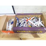 A box of complete model aircraft, together with a few unfinished, approximately 40 in total.