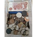A tub of assorted GB & world coins and three 10 shilling banknotes.