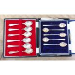Two cased sets of silver spoons, one set of six and another set of five enamelled spoons.