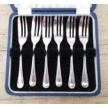 A cased set of six hallmarked silver cake forks. Viners, Sheffield 1937 wr 3.4oz