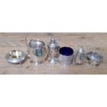 Five pieces of hallmarked silver comprising a twin handle mug, two salts, two pepper pots and a