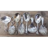 A collection of eight silver caddy spoons comprising; James Edward Barry Sheffield 1967, Norton &