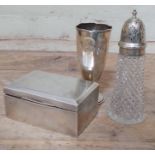 Three pieces of hallmarked silver comprising a cigarette box, a vase and a silver topped sugar
