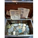 A lidded wooden box of assorted GB & world coins and banknotes.