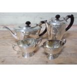 A George VI Art Deco style four piece silver tea service, bakelite handles, Henry Clifford Davis,