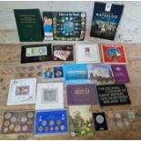 A box of assorted coin sets and commemorative coins to include the coinage of great britain and