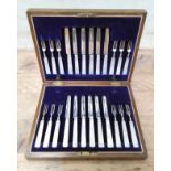 A cased set of George VI silver and mother of pearl fruit knives and forks, Watson & Gillott (